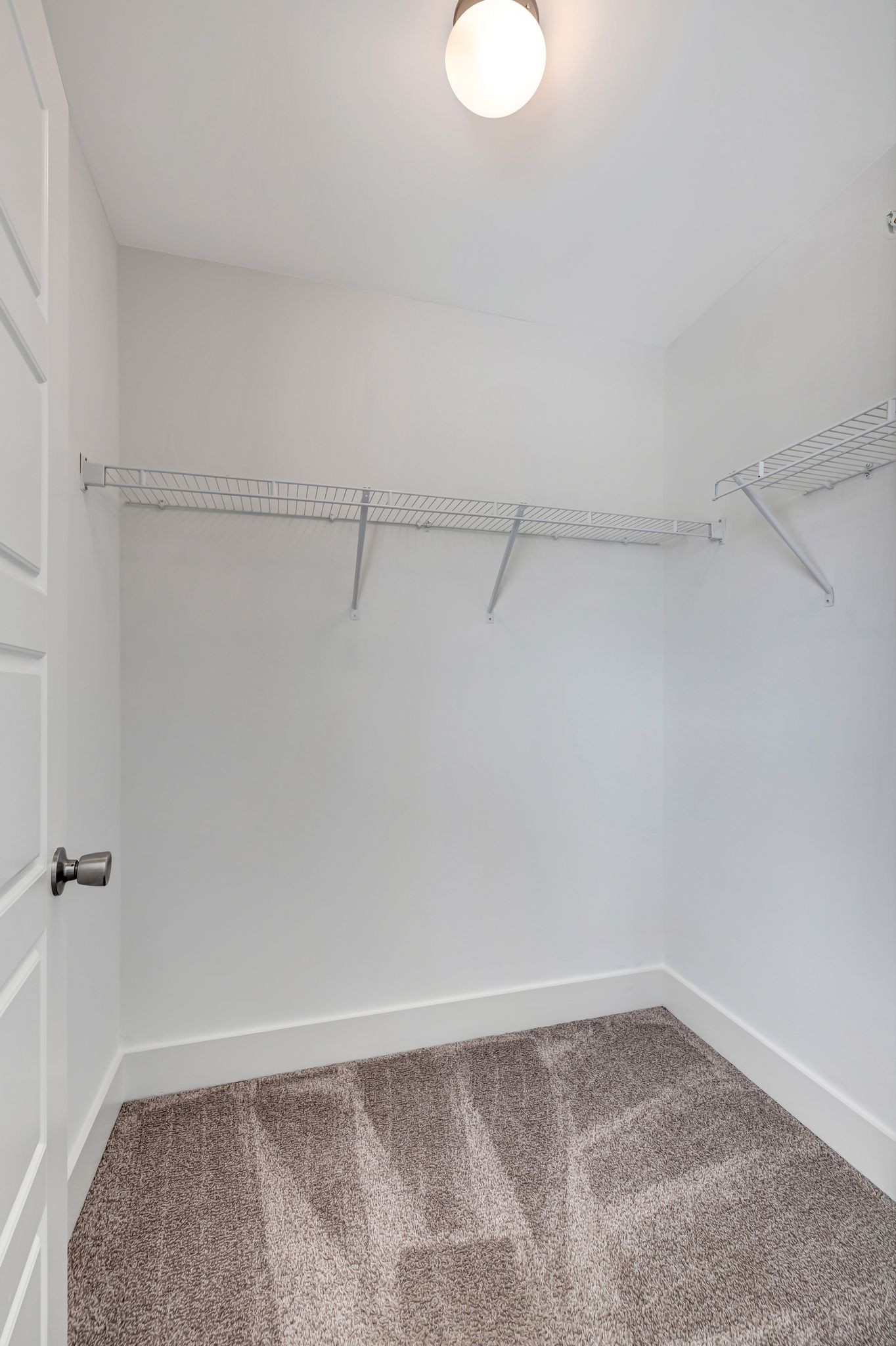 1134 Somerset Springs Drive Spring Hill, TN 37174 - Photo 18 of 28 a view of a room with racks on the wall