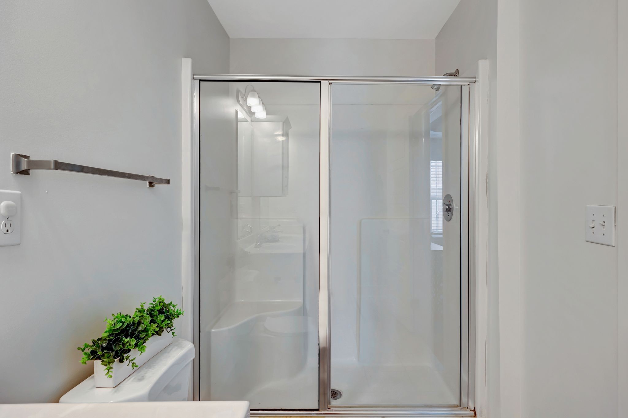 1134 Somerset Springs Drive Spring Hill, TN 37174 - Photo 20 of 28 a bathroom with a glass shower door
