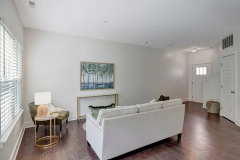 a living room with furniture and a table