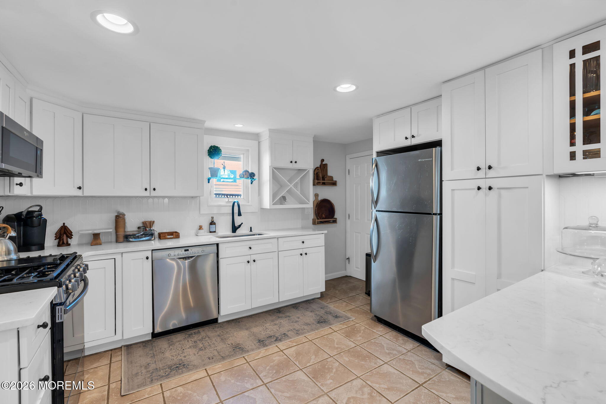 115 10th Avenue Spring Lake, NJ 07762 - Photo 17 of 30 a kitchen with granite countertop cabinets a refrigerator and a sink