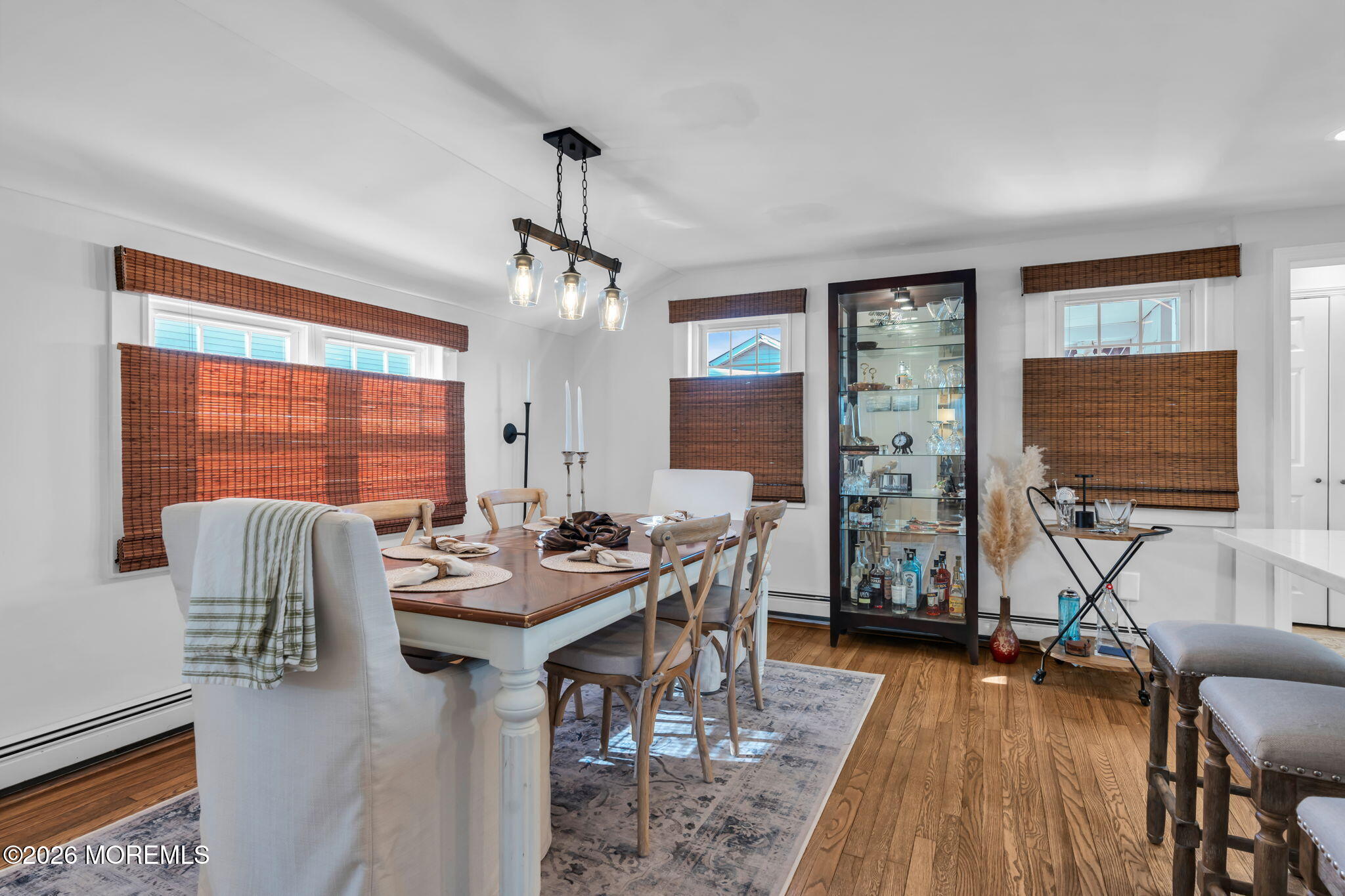 115 10th Avenue Spring Lake, NJ 07762 - Photo 20 of 30 a living room with furniture a floor to ceiling window and wooden floor