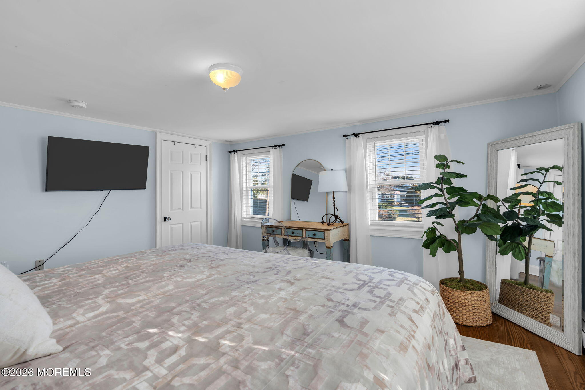 115 10th Avenue Spring Lake, NJ 07762 - Photo 24 of 30 a bedroom with a bed and a potted plant