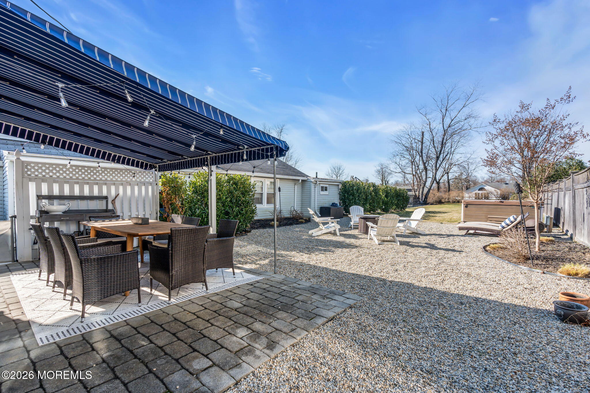 115 10th Avenue Spring Lake, NJ 07762 - Photo 9 of 30 a view of a patio with a table and chairs