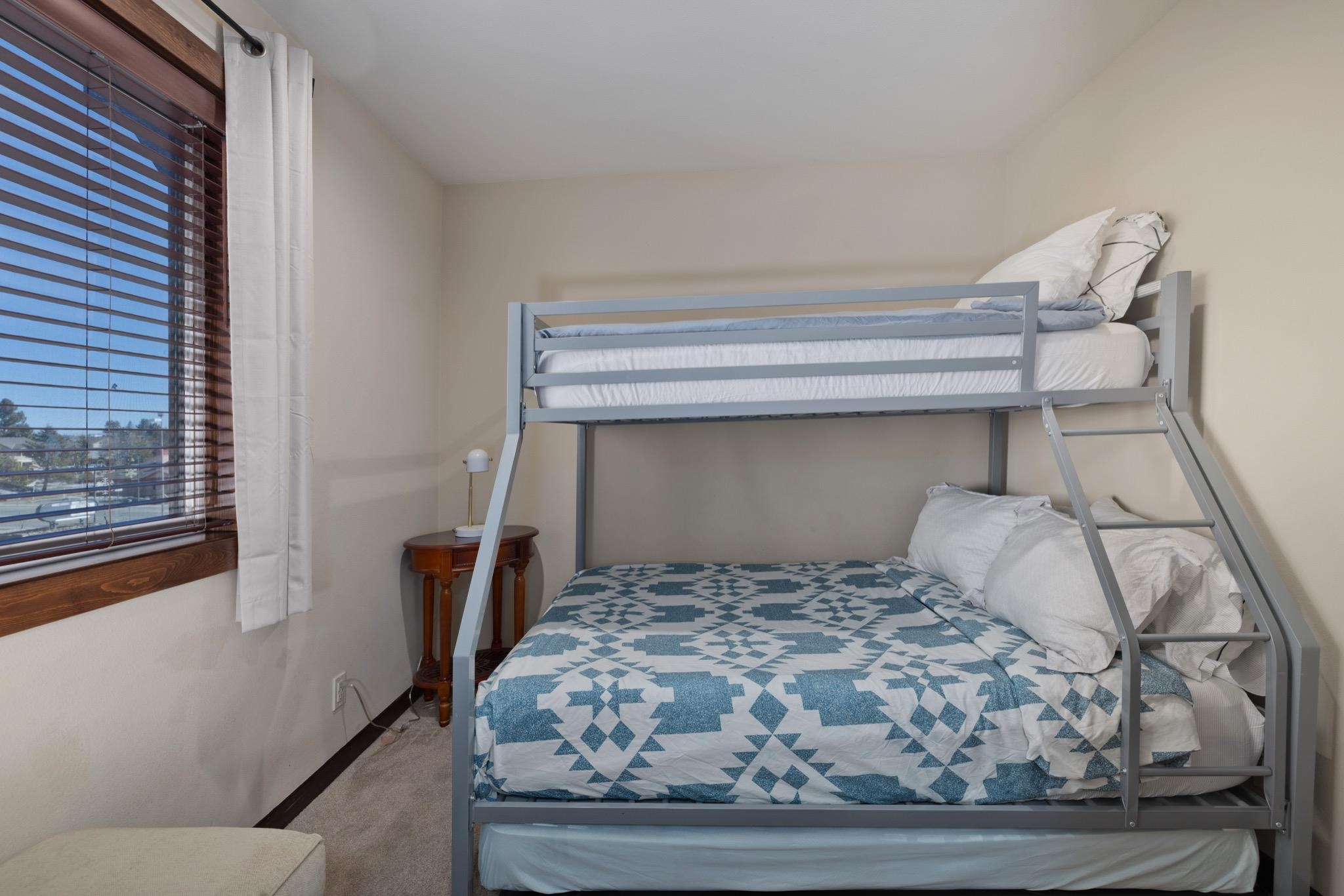 28 Oak Tree Way, Unit 8 Mammoth Lakes, CA 93546 - Photo 23 of 32 a bedroom with a bed and window