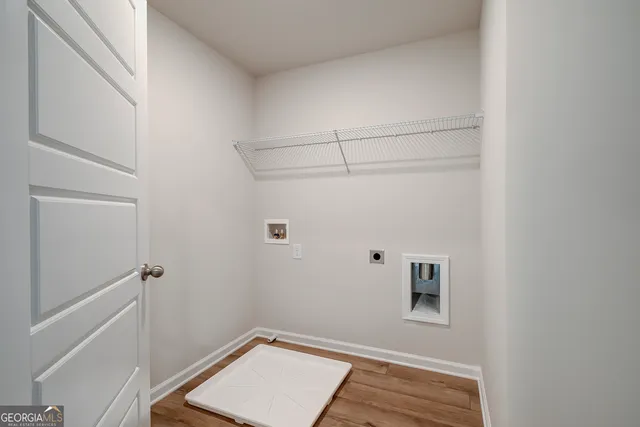 a view of swimming pool with seating area and trees in the background