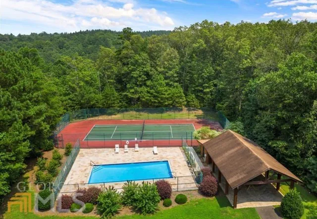 an aerial view of a house with a yard