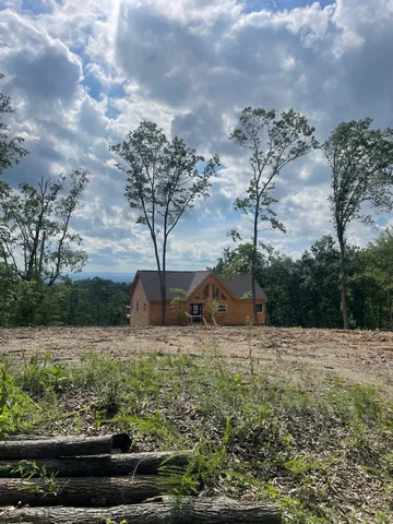 a view of a house with a swimming pool