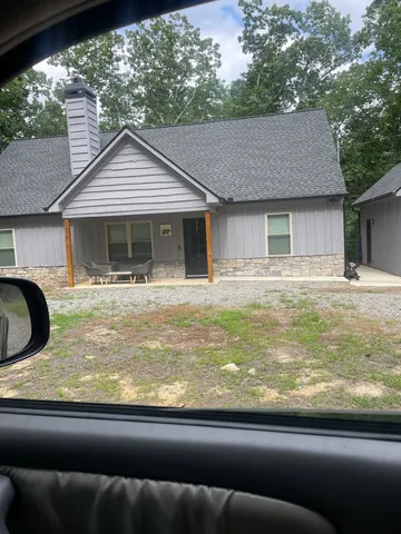 a view of a house with a snow in the yard