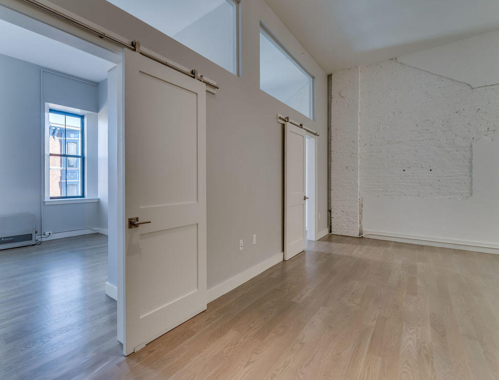 10 Exchange Street, Unit 312 Portland, ME 04101 - Photo 23 of 33 023_barndoorbedroomb