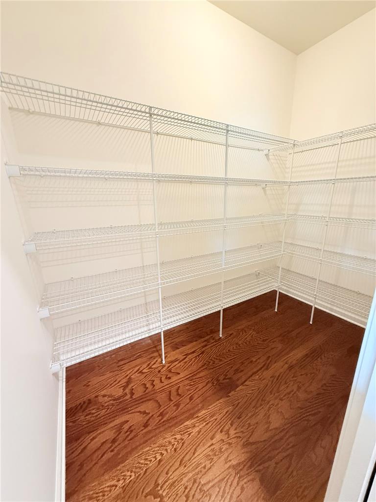 328 Abby Road, Unit LOT 15 Macungie, PA 18062 - Photo 9 of 26 Ample wire shelving provides generous storage in this functional pantry, featuring rich hardwood flooring.