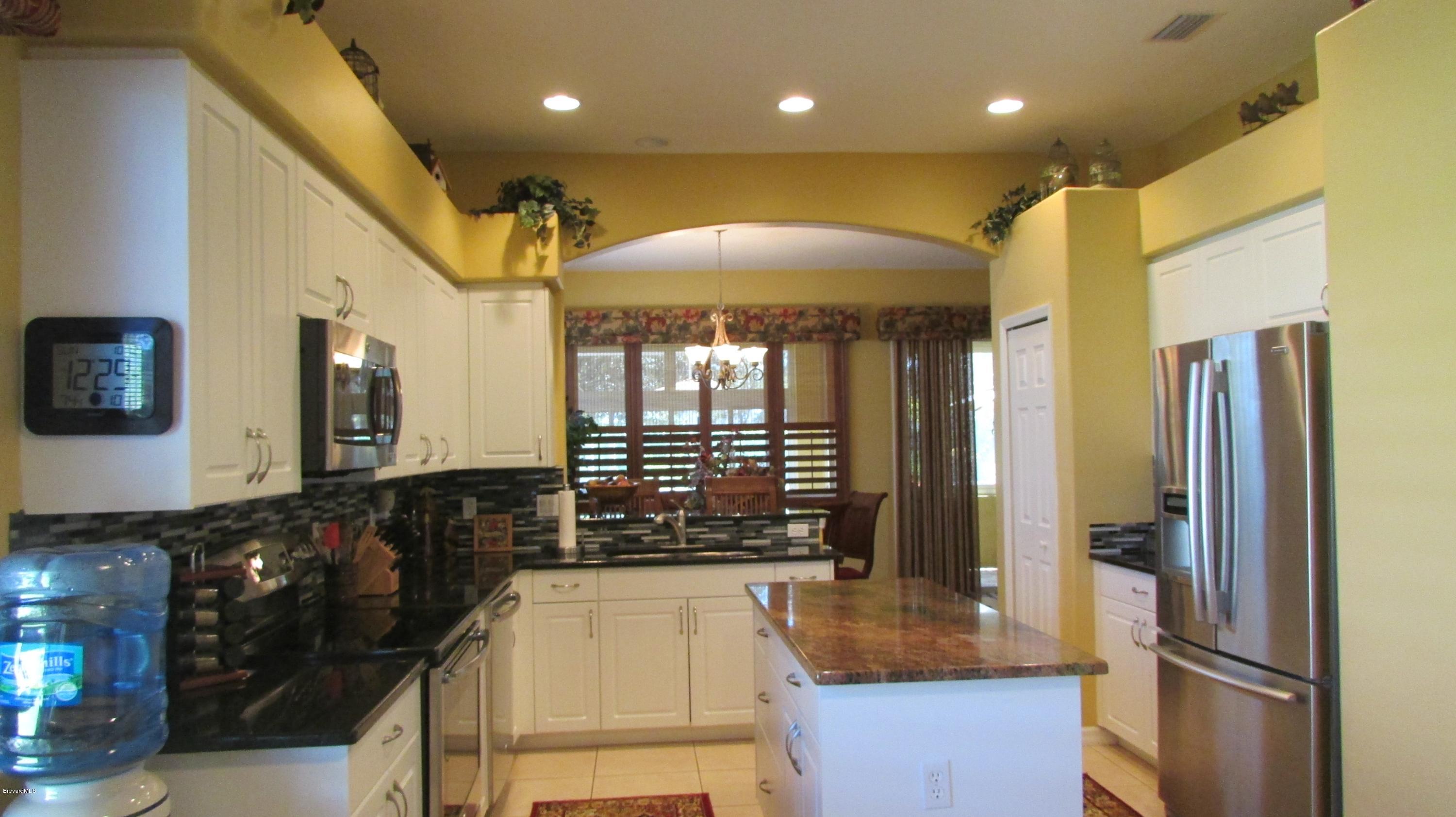 7161 Ralston Street Melbourne, FL 32940 - Photo 8 of 24 Kitchen View from Eat-in Area