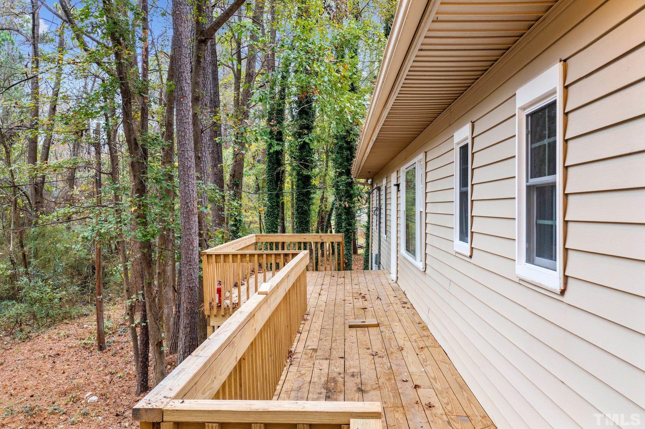 1124 Harper Road Raleigh, NC 27603 - Photo 12 of 59 a view of balcony with wooden floor and fence