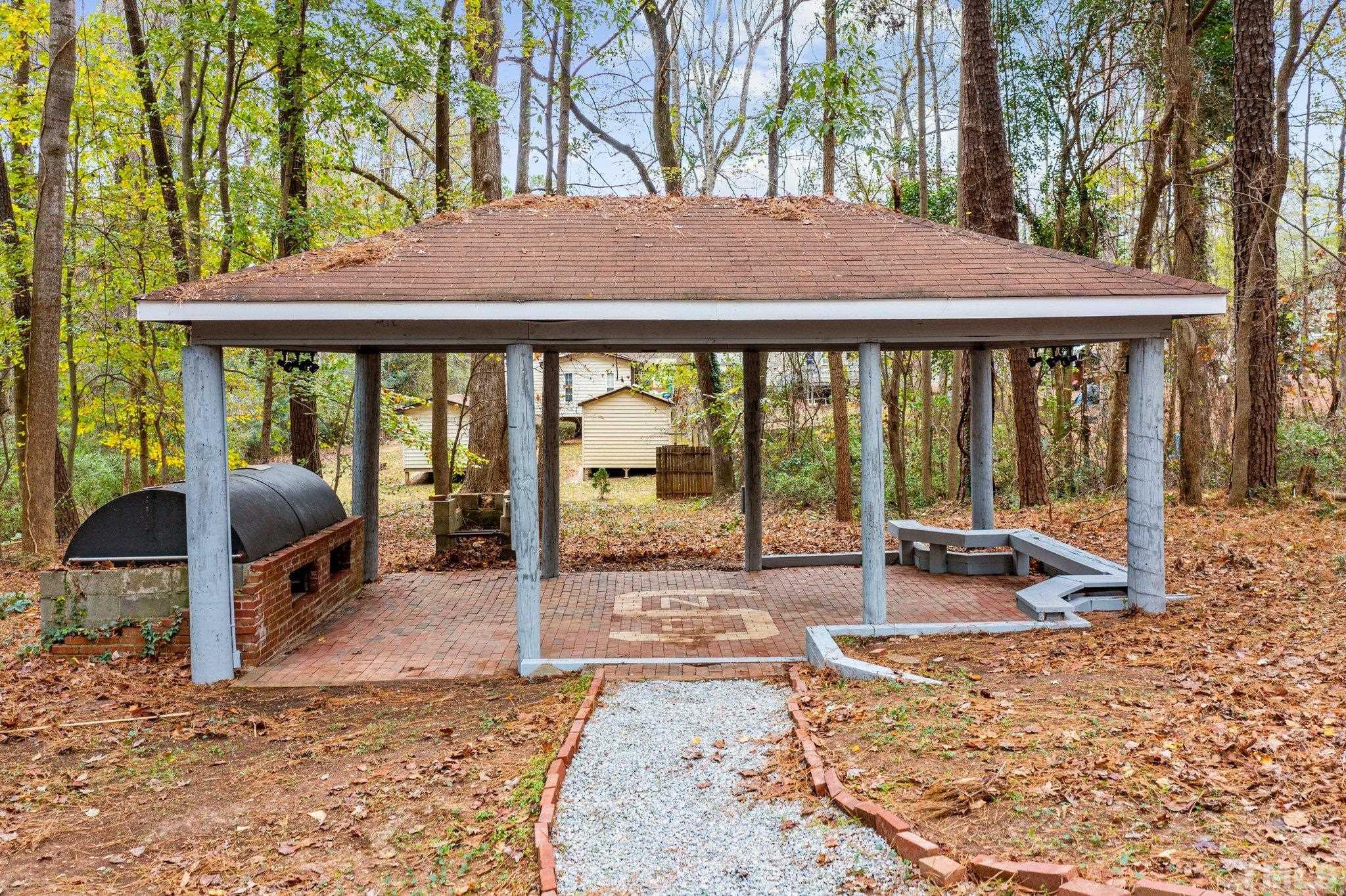 1124 Harper Road Raleigh, NC 27603 - Photo 21 of 59 a view of a patio with a table chairs and a patio