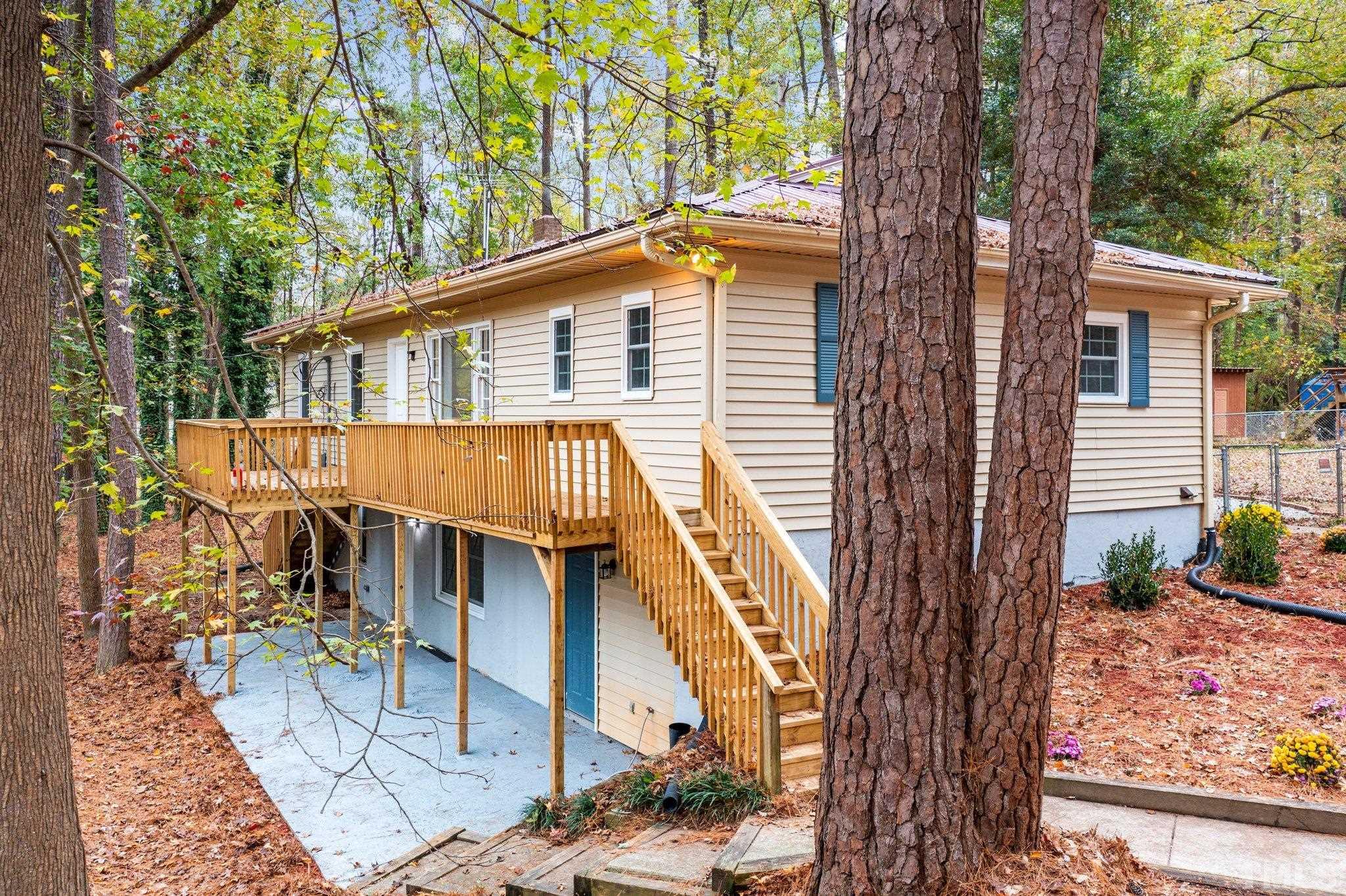 1124 Harper Road Raleigh, NC 27603 - Photo 4 of 59 a view of a house with backyard and sitting area