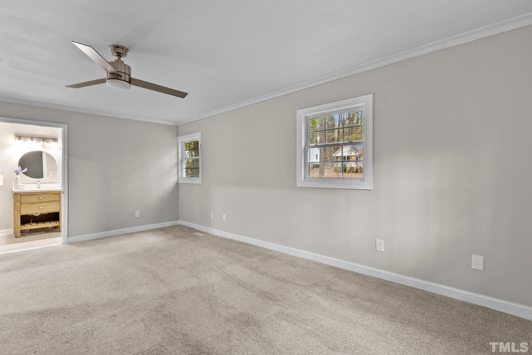 1124 Harper Road Raleigh, NC 27603 - Photo 44 of 59 a view of an empty room with a window and a kitchen