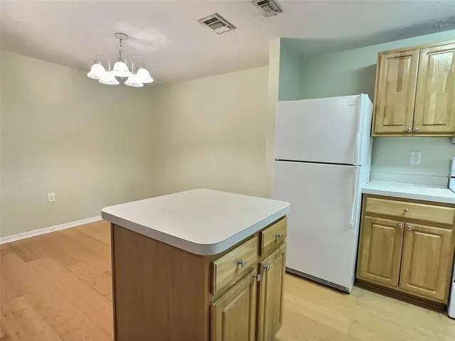 a white refrigerator freezer sitting in a kitchen