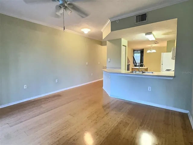 a view of a bathroom with a sink and mirror