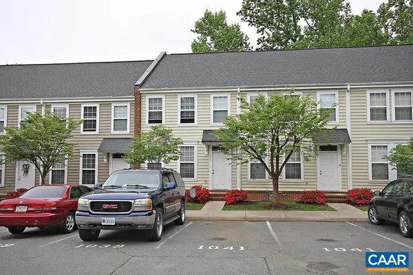 a car parked in front of a house
