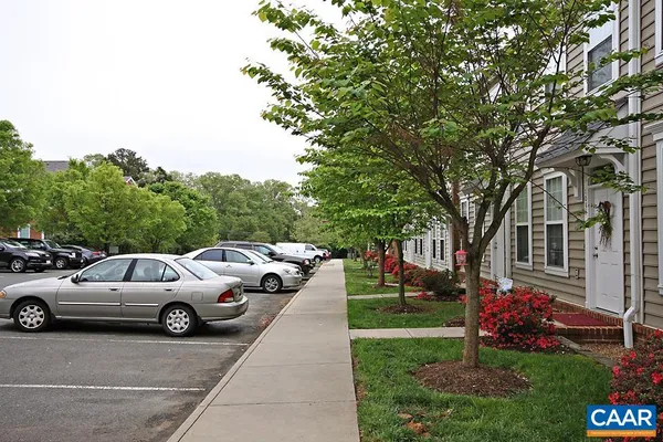 a view of street with parked cars