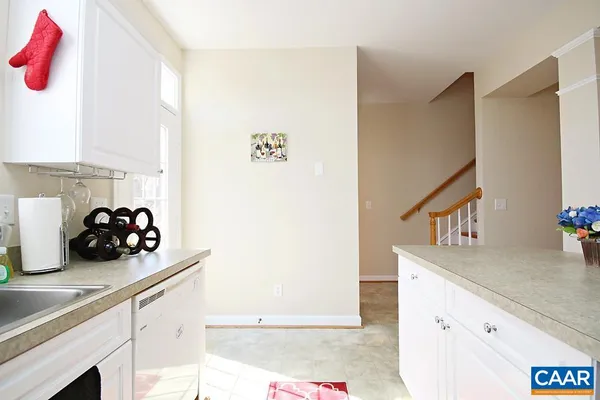 a kitchen with a sink and a stove
