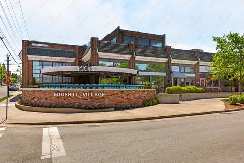 a view of a building with sitting area