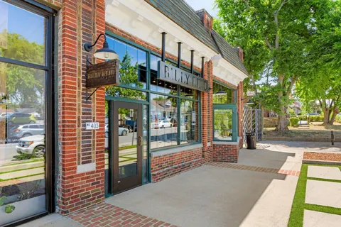 a view of a house with backyard porch and sitting area