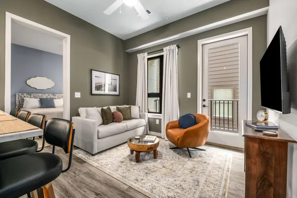 a living room with furniture and a flat screen tv