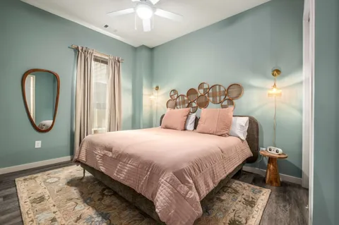 a bedroom with a bed and a window