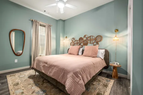 a bedroom with a bed and a window