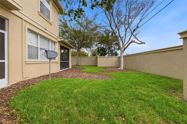 a view of house with backyard