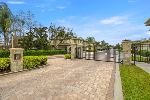 a view of a garden with a building in the background