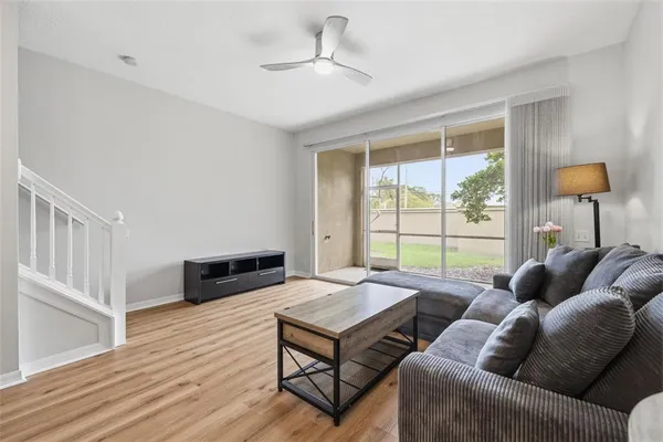a living room with furniture and a large window