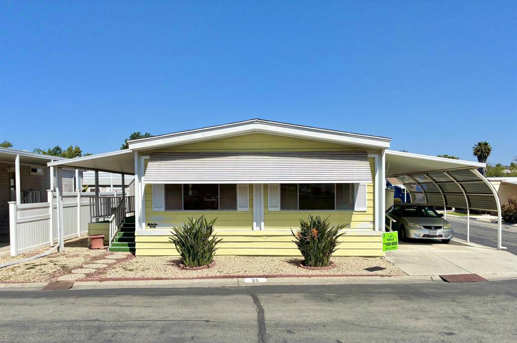 2130 Sunset Drive, Unit 99 Vista, CA 92081 - Photo 1 of 1 a view of a house with patio