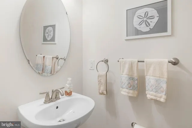 a dining hall with stainless steel appliances kitchen island granite countertop a refrigerator and stove