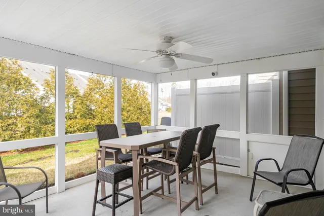 a view of a house with pool and chairs