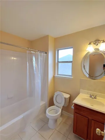 a bathroom with a granite countertop sink toilet a mirror and shower