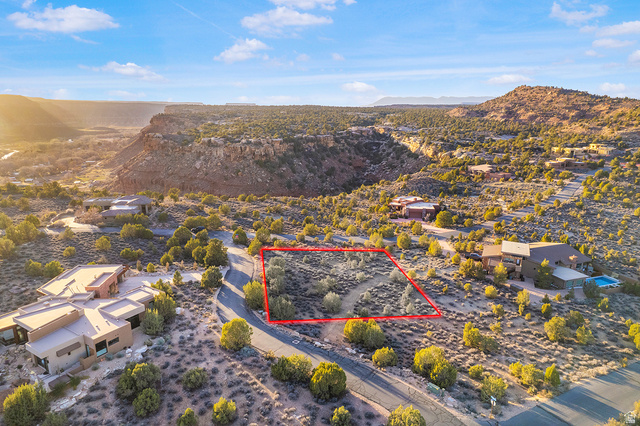 3008 Navajo Way Springdale, UT 84767 - Photo 4 of 16 Aerial view of residential area with property boundaries highlighted and a mountain backdrop