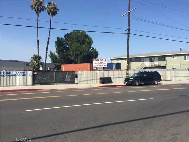 a view of street with parked cars