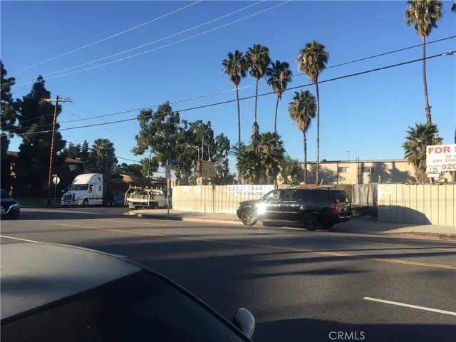 a view of a street with cars