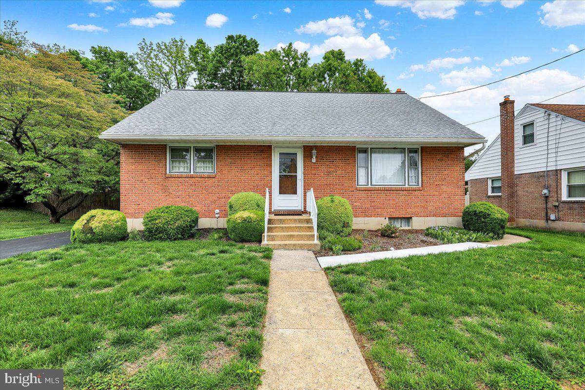 1224 Commonwealth Boulevard Reading, PA 19607 - Photo 1 of 27 a front view of a house with a yard