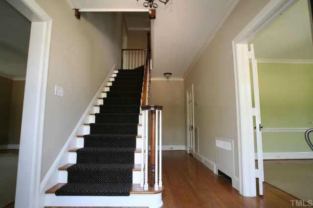 2211 St Marys Street Raleigh, NC 27608 - Photo 3 of 10 a view of entryway with wooden floor and stairs