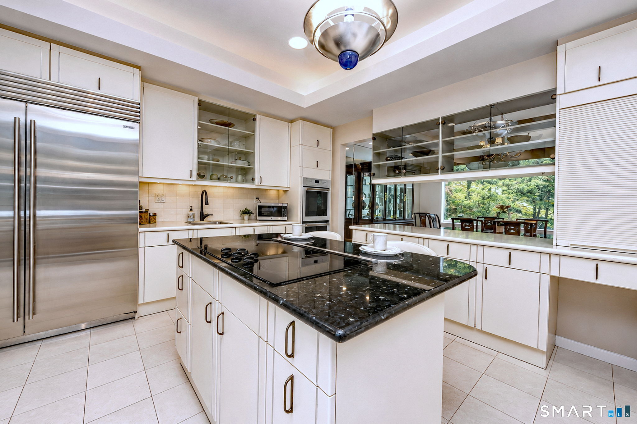 25 Milan Road Woodbridge, CT 06525 - Photo 7 of 40 a kitchen with stainless steel appliances granite countertop a sink and a stove
