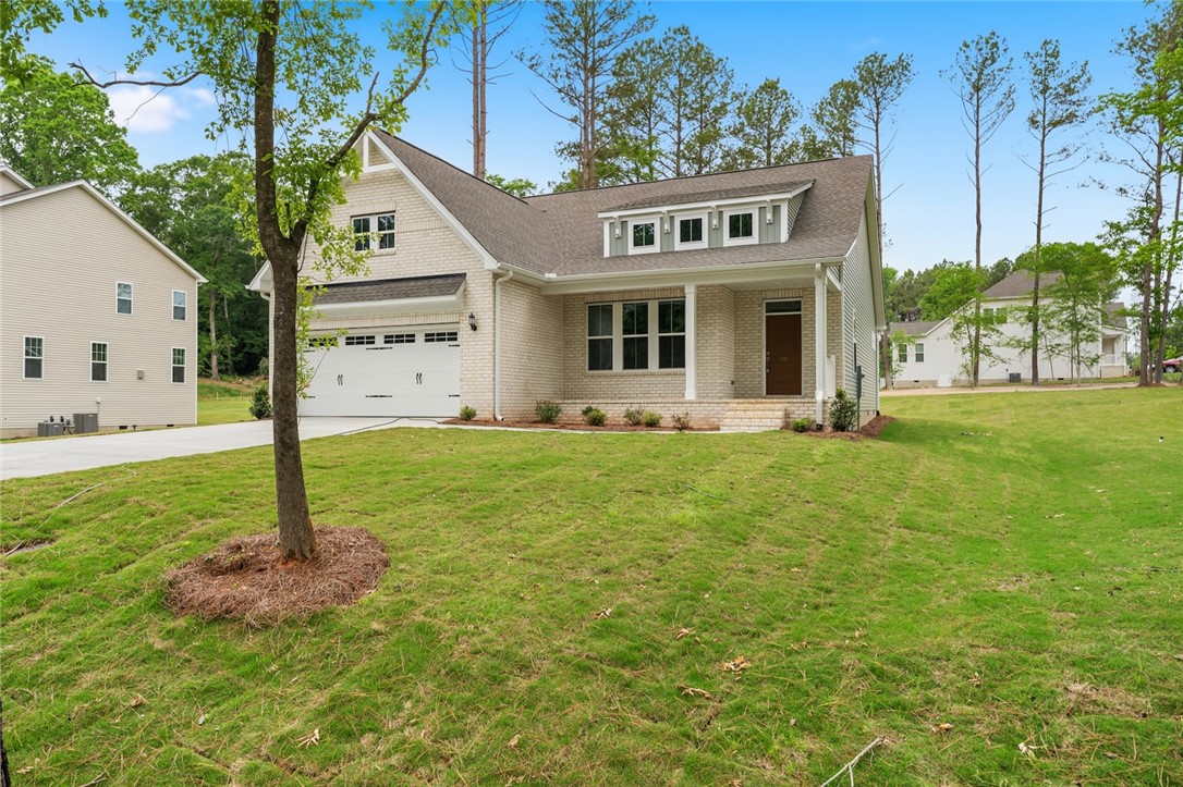 110 Lakeside Drive Anderson, SC 29621 - Photo 3 of 34 This newly constructed home features a well-maintained lawn and a welcoming facade.