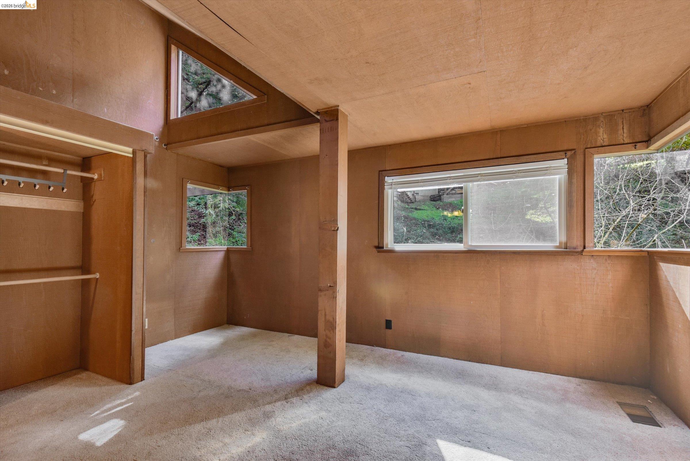 9 Wildwood Road Orinda, CA 94563 - Photo 17 of 34 a view of a hallway with a window