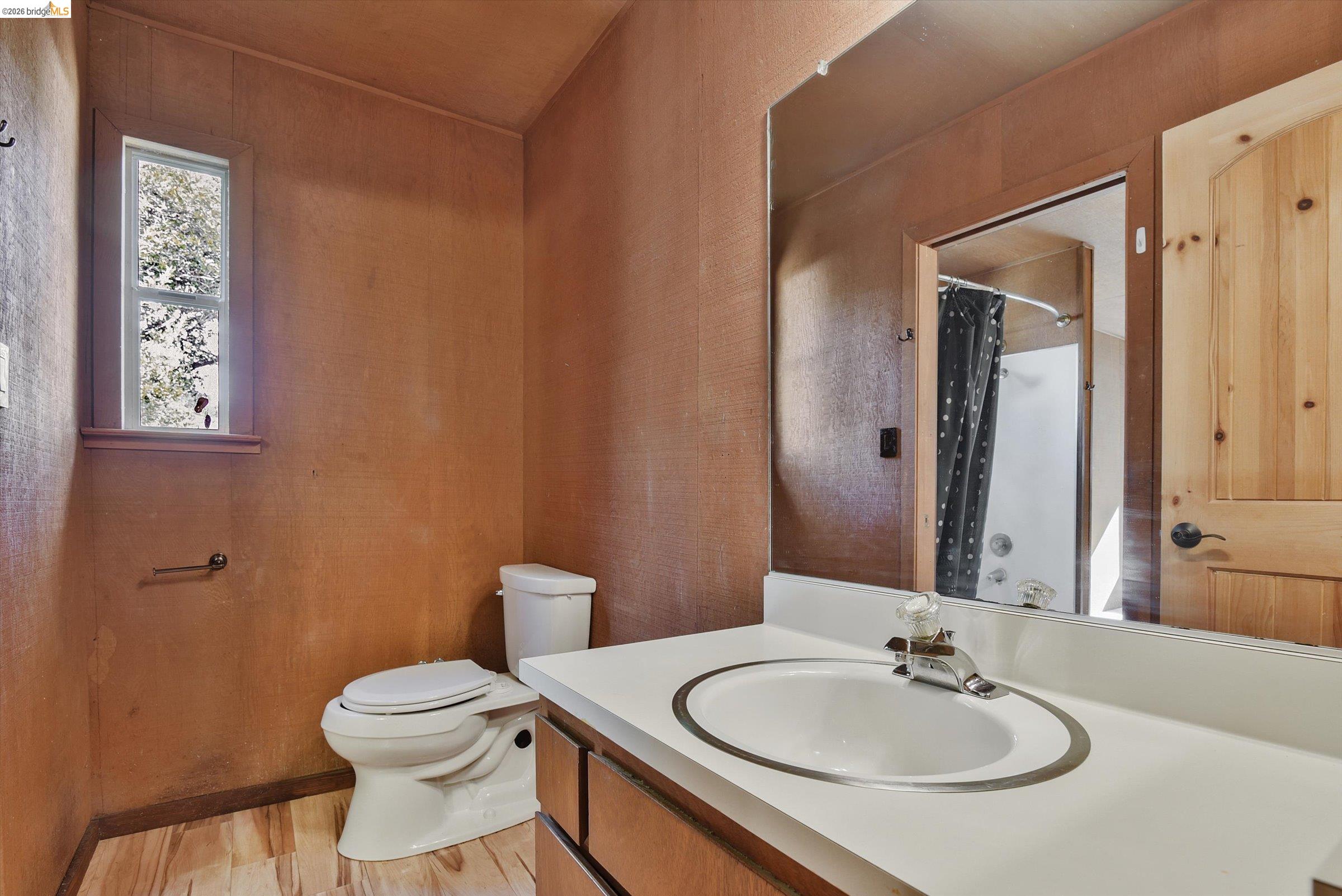 9 Wildwood Road Orinda, CA 94563 - Photo 18 of 34 a bathroom with a sink toilet and mirror