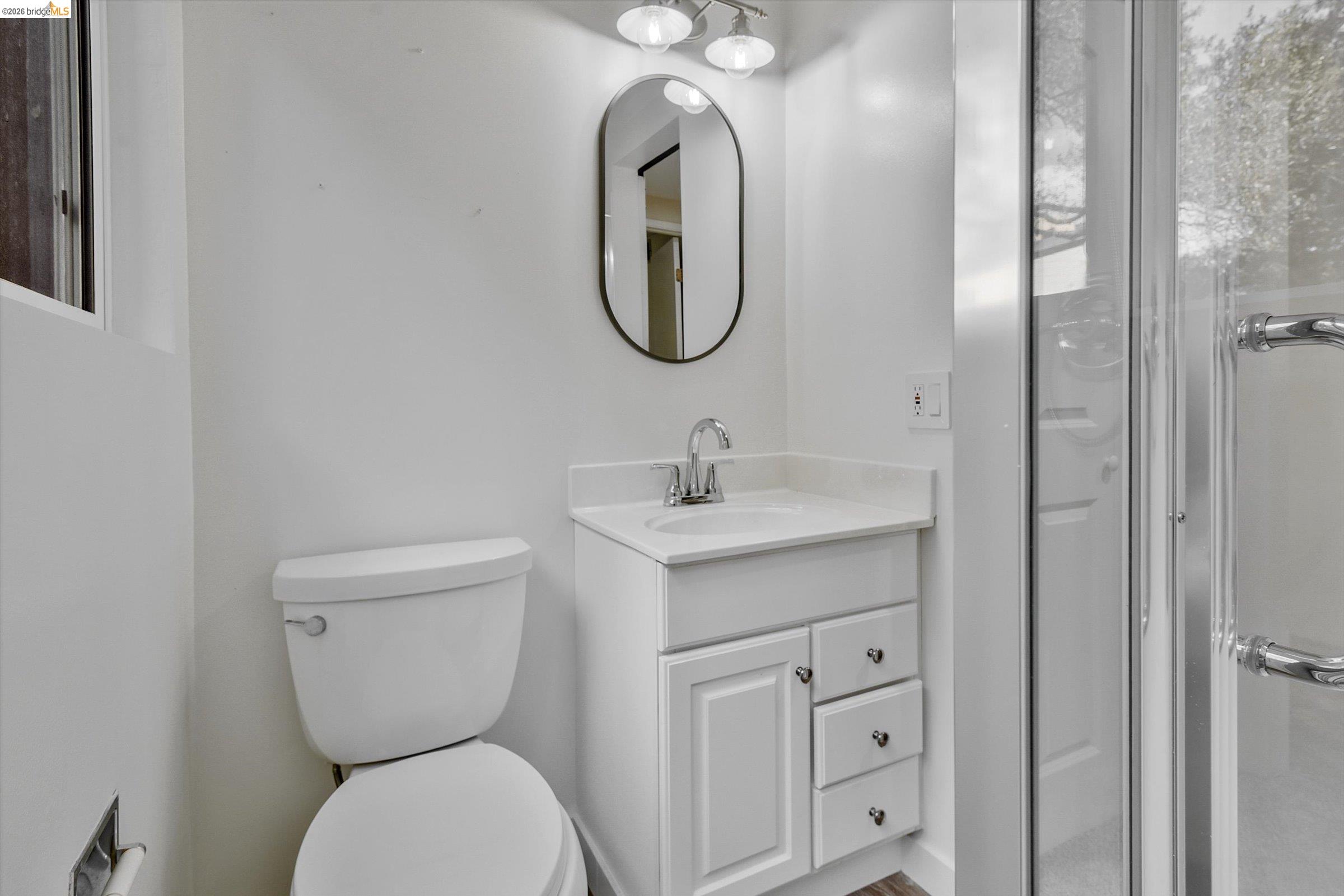 9 Wildwood Road Orinda, CA 94563 - Photo 26 of 34 a bathroom with a toilet sink and mirror