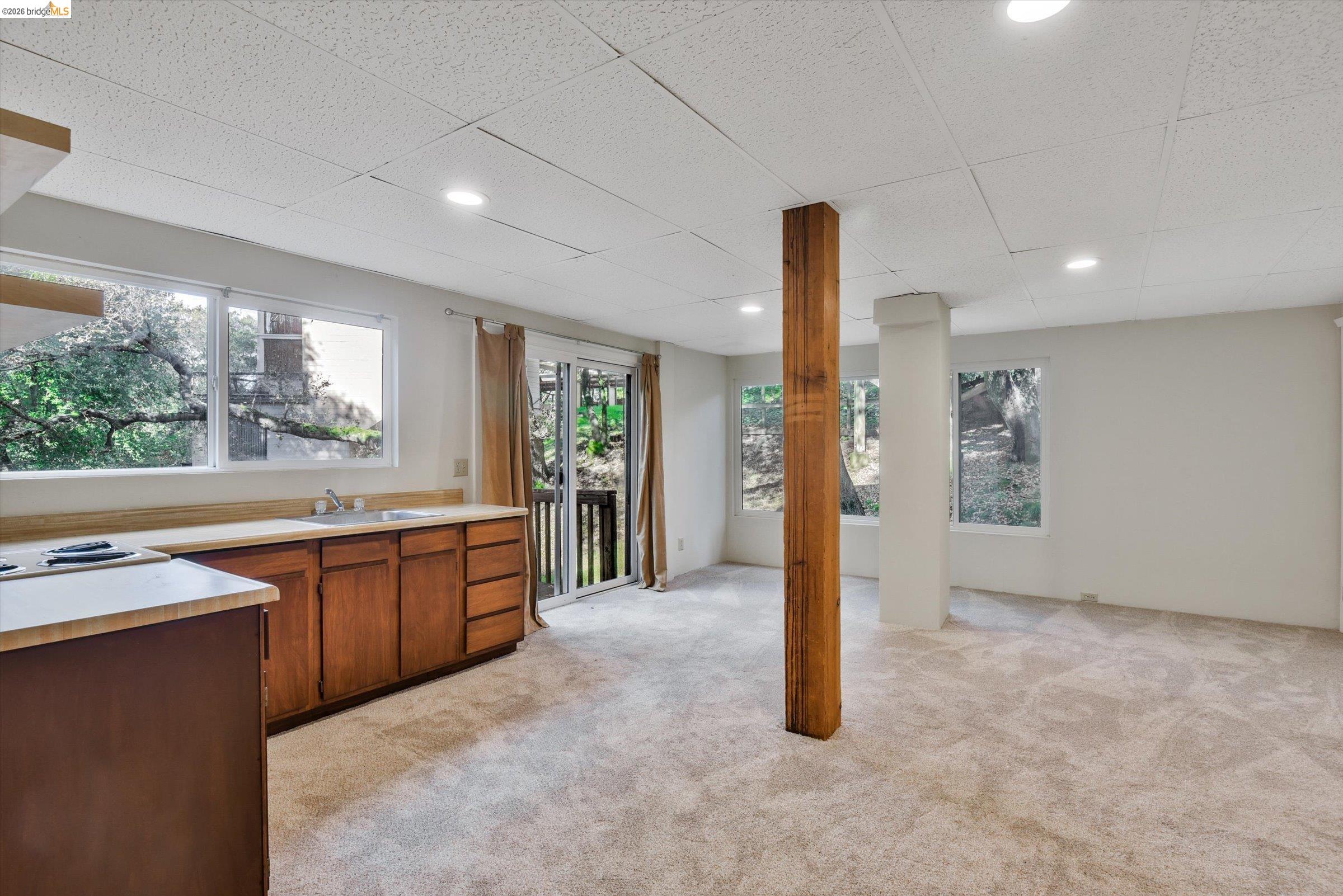 9 Wildwood Road Orinda, CA 94563 - Photo 28 of 34 a kitchen with stainless steel appliances granite countertop a sink a counter space and a window