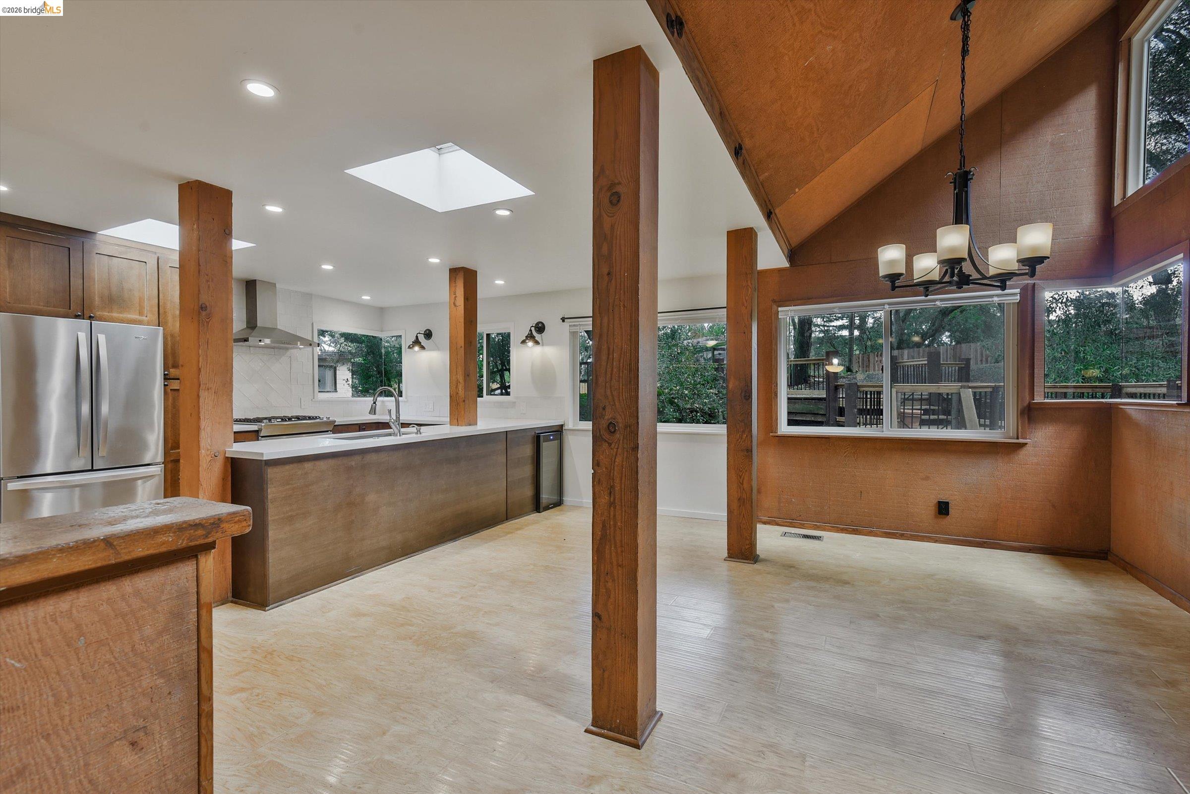 9 Wildwood Road Orinda, CA 94563 - Photo 4 of 34 a kitchen with stainless steel appliances kitchen island granite countertop a refrigerator a oven and a sink with granite countertops