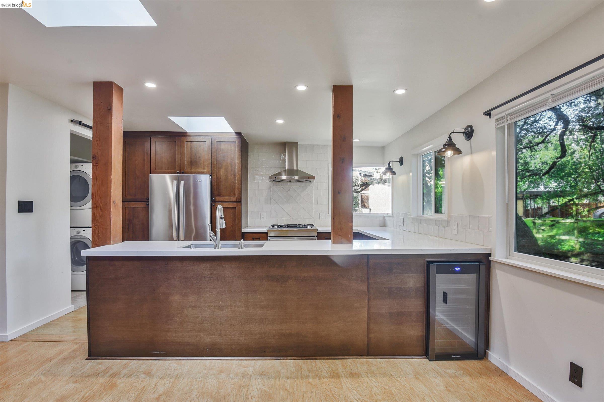 9 Wildwood Road Orinda, CA 94563 - Photo 6 of 34 a large kitchen with stainless steel appliances granite countertop a large counter top a stove and a refrigerator