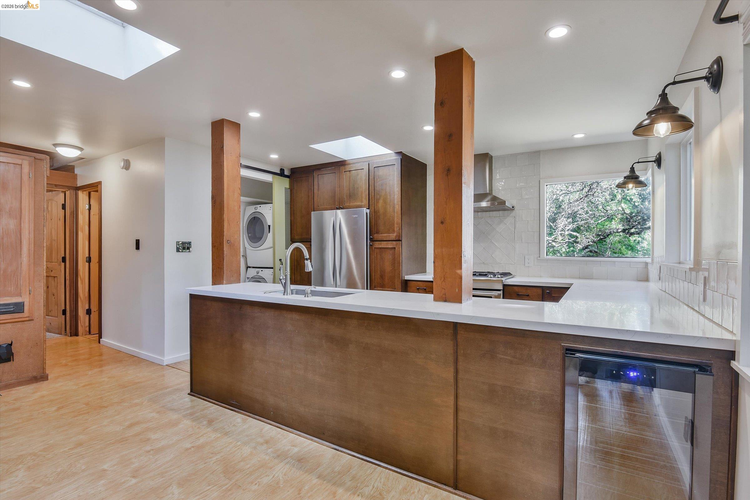 9 Wildwood Road Orinda, CA 94563 - Photo 8 of 34 a kitchen with stainless steel appliances a sink a refrigerator and a wooden cabinets